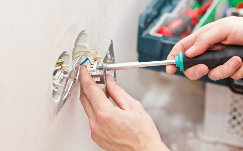 The hands of an electrician